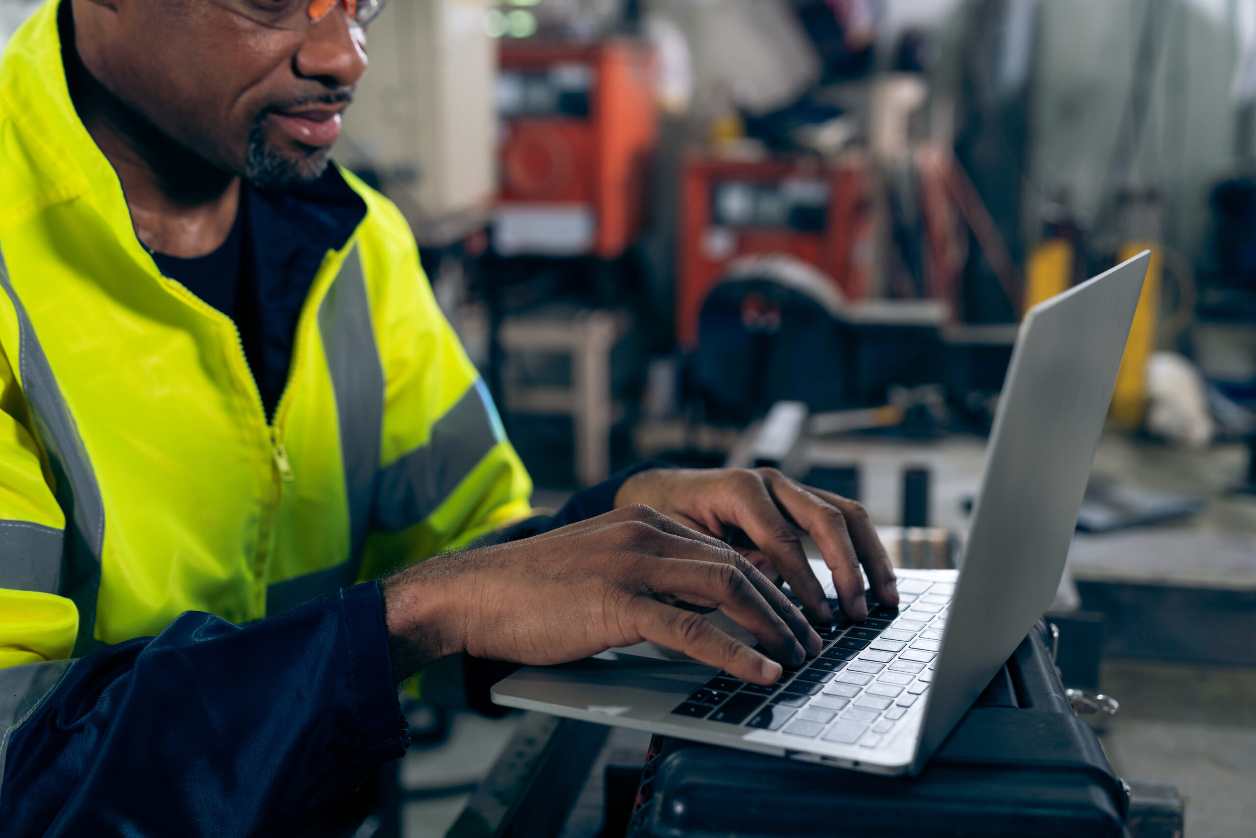 factory worker working with laptop computer adept procedure checklist scaled